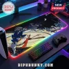 Rectangular LED gaming mousepad featuring Sonic the Hedgehog graphics over a clock face on a desk with a gaming console.!