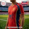 Man wearing red and navy soccer jersey with spiderweb pattern and Spanish national team crest on a stadium pitch.!