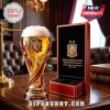 Spain National Team 2010 2026 World Cup Champions beer glass and matching red display box on a mahogany wooden table.