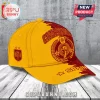 Spain National Team 2026 World Cup Champions cap in yellow and red with trophy graphic and Campeones text on a wooden base.