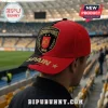 Spain National Team 2026 World Cup Champions red and black baseball cap with front embroidery in a stadium setting.