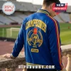 Spain National Team 2026 World Cup Champions varsity jacket in blue with gold text, stadium graphics, and striped trim.