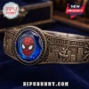 Spider-Man Engraved Bracelet featuring a blue faceted gemstone, embossed city skyline, and character mask on antique metal.