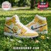 SpongeBob SquarePants high-top sneakers in yellow and white leather with autism awareness puzzle piece patterns on grass.!
