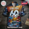 Star Trek 60th anniversary button-down shirt featuring a space nebula print, starships, and cast members on dark wood.!