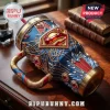 Superman Man of Steel 40oz Stanley Handle Tumbler in blue and gold with red accents, crystals, and iconic S-shield logo.