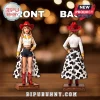 Taylor Swift inspired doll wearing a red cowgirl hat, white shirt, denim shorts, and a cow-print skirt on a display stand.!