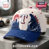Texas Rangers x Godzilla Minus One baseball cap in white and blue featuring a city skyline, red moon, and monster graphic.