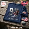 25th Anniversary We Will Never Forget T-Shirt in navy blue with Twin Towers graphic, American flag, and memorial text.