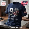25th Anniversary We Will Never Forget T-Shirt in navy blue featuring twin tower graphics, American flag, and 9.11 date text.