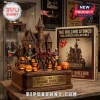 The Rolling Stones Halloween 2026 Acrylic Plaque featuring band figurines in front of a haunted castle with glowing pumpkins.