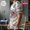 Toronto Blue Jays Ripped Effect Distressed T-Shirt with frayed edges, team logos, and baseball text on an off-white fabric.