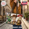 Toy Story characters Woody, Buzz Lightyear, Jessie, Rex, and Slinky Dog printed on a cream leather tote bag with straps.!