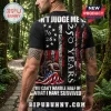 Black t-shirt featuring a kneeling soldier with an American flag, 1776-2026 text, and distressed patriotic graphics.!