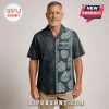 Middle-aged man wearing a black short-sleeve button-down shirt with gray tropical leaves and U.S. Submarine Force text.!