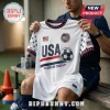 White USA soccer jersey with navy lettering, a soccer ball graphic, American flag patches, and red and navy star trim.!
