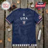 Navy blue USA soccer style jersey featuring a Statue of Liberty graphic, American flag details, and white text on wood.!