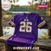 Purple Minnesota Vikings football jersey with white and gold number 26 and R&B Tour text on a wooden park bench.!