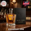 Van Halen whiskey decanter with gold VH logo and matching black presentation box on a wooden bar top.!
