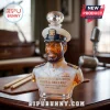 Victor Willis bust whiskey decanter in a navy uniform with a crystal stopper, set on a wooden desk with a microphone.!