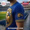 West Coast Eagles blue t-shirt with gold embossed eagle mascot, ornate floral patterns, and 1986 crest in stadium background.!