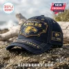 Dark denim West Coast Eagles baseball cap with gold eagle emblem, studs, and EST 1986 patch on a rocky beach.!