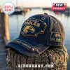 West Coast Eagles denim baseball cap with gold embroidered eagle logo, brass rivets, and side patch on wooden piling.!