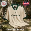 Cream v-neck jersey with dark green trim, Adidas branding, and Chavarria text with a floral print on a stone table.!