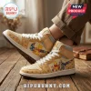 Cream and tan high-top sneakers featuring Winnie the Pooh characters, puzzle piece accents, and Bee Kind text on the side.!