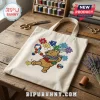 Canvas tote bag with Winnie the Pooh embroidery holding a puzzle-piece ribbon and the word Autism in colorful puzzle letters.!