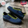 Custom Nike Air Force 1 sneakers in matte blue and lime green with black laces, black soles, and wings logo on heel.!