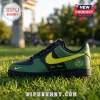 Custom green and black sneaker with yellow swoosh, Seattle logo, and personalized text on grass background.!