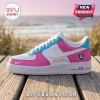 Custom pink, white, and light blue sneaker with Your Name text and a crest emblem on a wooden boardwalk at sunset.!