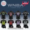 Four black customized WNBA-themed jerseys and matching hats featuring Wings, Fire, Valkyries, and Aces team graphics.!