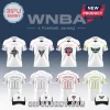 White WNBA themed football jerseys and matching baseball caps for Aces, Valkyries, Fire, and Wings teams on blue background.!