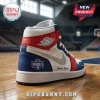 Custom high-top basketball sneaker with red, white, and blue leather panels, Air Jordan logo, and Mystics team branding.!