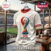 White textured soccer jersey featuring a 2026 North America trophy logo, red trim, and scattered stars on a stadium backdrop.!
