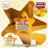 Yellow crochet star plush toy with black plastic eyes, pink cheeks, holding a sign that says And so the adventure begins.!