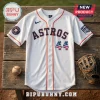 Houston Astros white button-up baseball jersey with orange trim, number 44 featuring stars and stripes pattern, on wood.!
