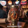 ACDC High Voltage Gold 40oz Stanley Tumbler featuring raised electric guitar art, fiery graphics, and red jewel accents.