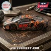 ACDC Lamborghini Aventador diecast model car featuring lightning graphics and band logos on a wooden table surface.