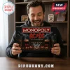 AC/DC Monopoly Collector Board Game box held by a smiling man in front of a bookshelf.