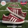 Adidas Oklahoma Sooners Suede Casual Sneakers in maroon with white stripes, graphics of the OU logo and a covered wagon.