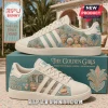 Adidas x The Golden Girls casual sneakers in cream featuring floral patterns and a graphic of the four main characters.
