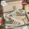 Adidas x The Golden Girls casual sneakers featuring character graphics and tropical prints in a branded collector box.