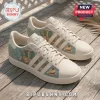 Adidas x The Golden Girls casual sneakers featuring pastel floral graphics, cheesecake motifs, and sitcom quote text.