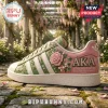 Alpha Kappa Alpha Floral Casual Sneakers in pink and green with embroidered roses, pearls, and AKA 1908 text detail.