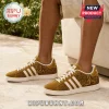 Alpha Phi Alpha Cornell University Gold Sneakers featuring Greek letters, sphinx imagery, and white stripes on textured suede.