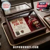 Angus Young Funko Pop keychain inside a wooden display case with a paper note featuring AC/DC iconography and lyrics.