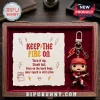 Angus Young Funko Pop keychain inside a wood case next to a paper card featuring red text and lightning bolt illustrations.